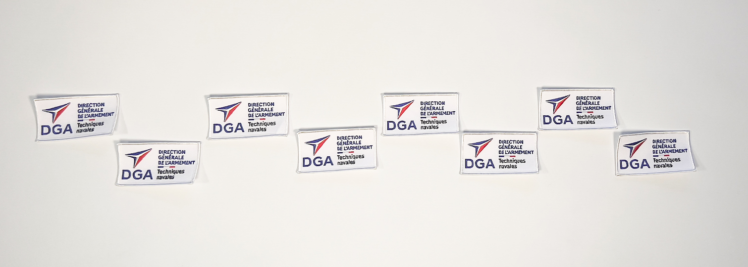 Combination of embroidered patches to sew on the uniforms of the members of the DGA