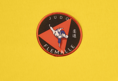 Heat-adhesive sublimated patches for the members of the Flémalle Judo Club.