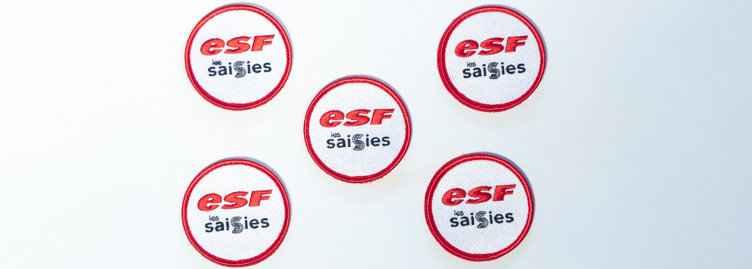 Combination of 90% embroidered custom badges for the ski instructors of ESF Les Saisies